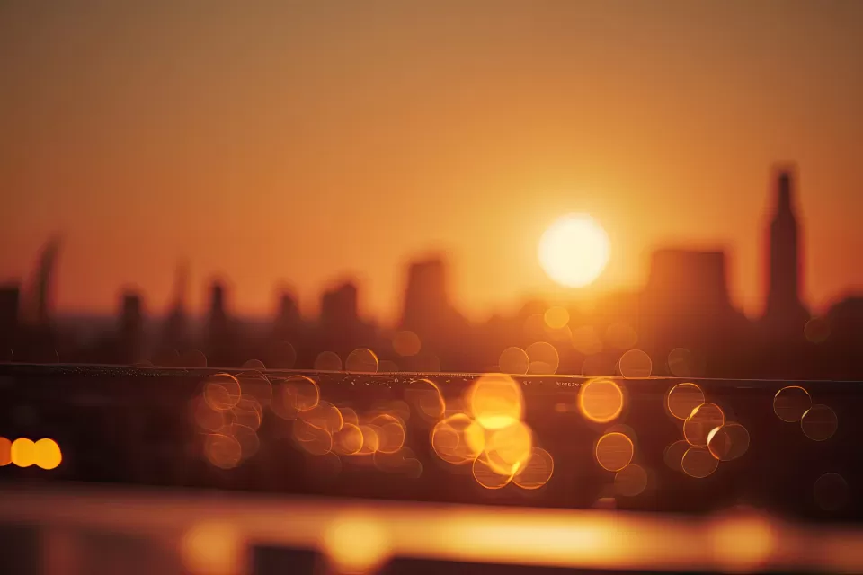 Blurred image of ciy skyline with orange filter indicating extreme heat
